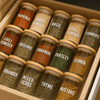 Herb and spice jars neatly organized in a kitchen drawer for efficient home organisation.