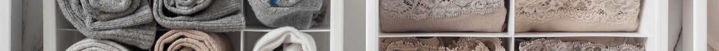 Drawer dividers for efficient home organisation with neatly folded clothing items.