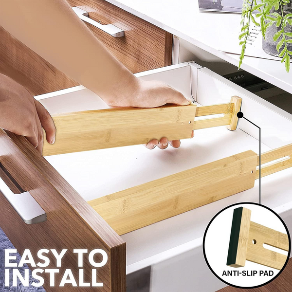 Person installing Bamboo Expandable Drawer Dividers – 4 Pack for kitchen drawer organisation and efficient storage use.