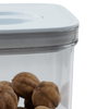 Close-up of a White Twist Canister storing nuts, ideal for kitchen or pantry organisation. Part of a 16 Pack storage organisers set.
