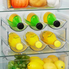 Clear stackable bottle organiser in fridge, ideal for kitchen storage, home organisation, and space-saving solutions in Australia.
