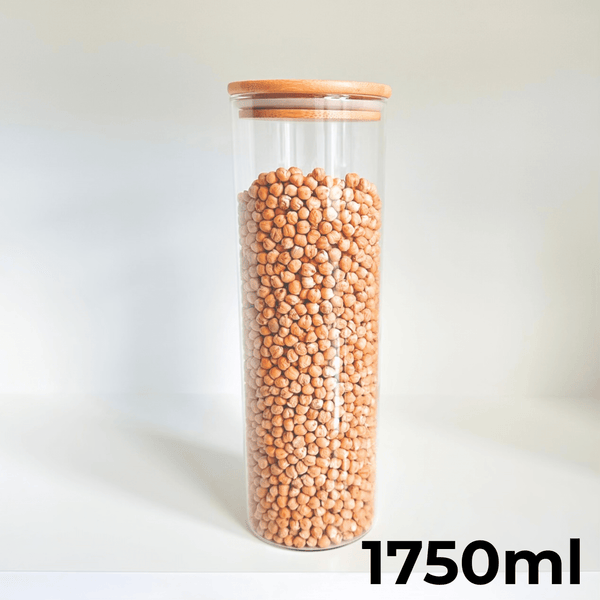 Round glass bamboo storage jar 1750ml filled with nuts, perfect for pantry organisation.