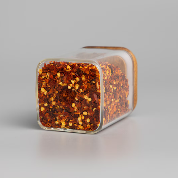Square acacia spice jar with red chili flakes, perfect for kitchen storage and home organisation; stylish glass container with bamboo lid.