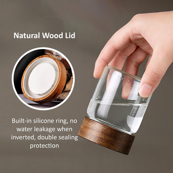 Hand holding 135ml glass jar with acacia lid, showcasing double sealing silicone ring, ideal for kitchen and pantry storage solutions.