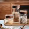 Stylish 1750ml acacia glass jar for pantry storage with bamboo lid, perfect for kitchen and bathroom organisation and decluttering.