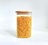 Glass jar filled with pasta, part of Square Bamboo Pantry Jars – 12-Pack Glass Storage Set, ideal for pantry organisation.