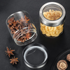 Glass storage jar with clear stainless lid, showcasing pasta and spices. Ideal for kitchen organization and space-saving solutions.