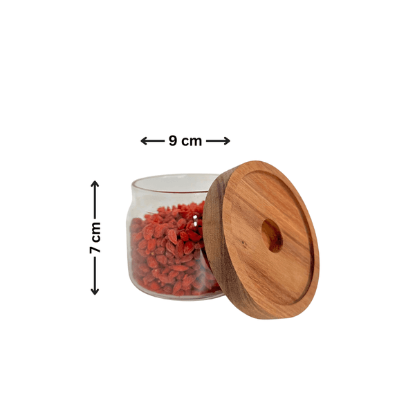 Round glass acacia storage jar with wooden lid, ideal for kitchen pantry organization and stylish home storage solutions.