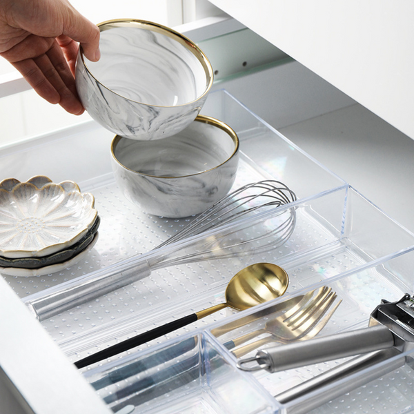 Small Clear Drawer Organisers holding cutlery in a kitchen, enhancing drawer organisation and maximising space for effective storage.