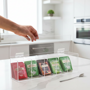 Clear Acrylic Tea Bag Organiser Box – 5 Compartment in use for kitchen organisation with various tea bags, ideal for pantry storage.