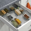 Expandable in-drawer rack with pantry jars for kitchen storage organisation.