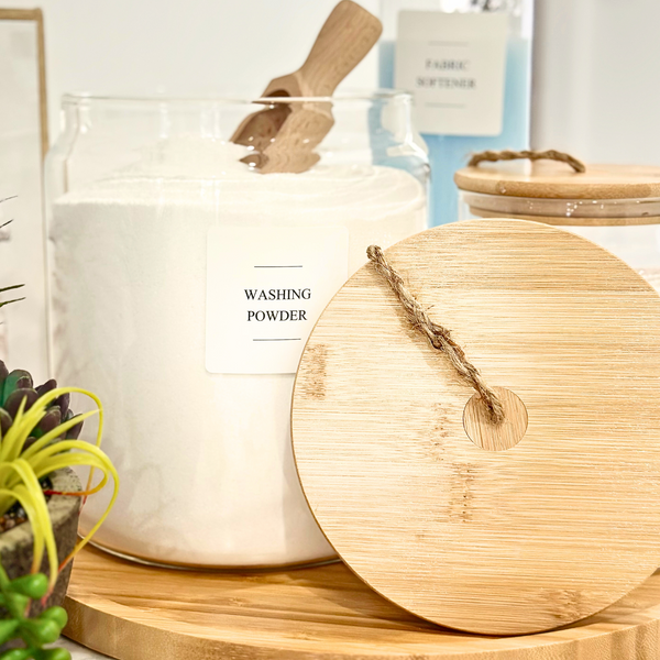 Jar of washing powder with a wooden lid on a surface