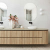 Modern bathroom with wooden vanity and white basins, featuring home organisation products for elegant storage solutions in Australia.