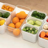 Triple clear fridge organizer with removable baskets holding fresh vegetables and fruits, ideal for kitchen storage.