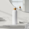 White Pump Bottle – 500 ml Refillable Dispenser on marble bathroom counter, ideal for kitchen organisation and storage organisers.