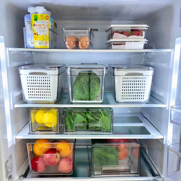 Transparent fridge containers, part of 13-pack storage organiser, holding fruits and vegetables for efficient kitchen use.