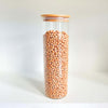 Tall round glass pantry jar with bamboo lid, ideal for chickpea storage and pantry organization.