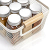 White Mesh Storage Basket with Wooden Handles filled with glass jars, ideal for kitchen and pantry organisation, enhancing storage space.