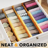Bamboo Expandable Drawer Dividers β 4 Pack (Long) used for neat drawer organisation with socks and towels in a bedroom setting.