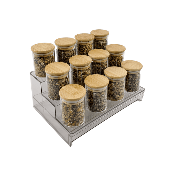 Clear herb and spice organiser with bamboo-lid jars for pantry storage.