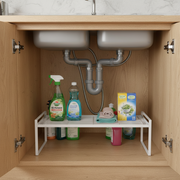 Metal Under Sink Shelf – White used for kitchen organisation, showcasing cleaning supplies neatly arranged in under sink storage.