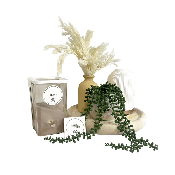 Round pantry sticker set on storage organiser jars next to decorative kitchen items.