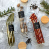 Clear herb and spice jars with bamboo lids for pantry storage
