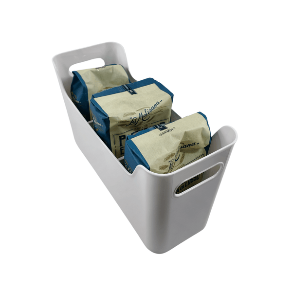 White pull-out storage organiser for pantry jars and kitchen baskets, space-saving design.