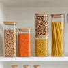 Set of kitchen containers with bamboo lids for pantry storage; includes jars for pasta, lentils, chickpeas. Storage Organisers Australia.