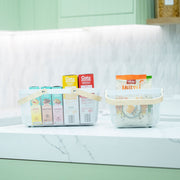 Small White Mesh Basket with Wooden Handle used as kitchen organisation for pantry items, highlighting storage organisers.