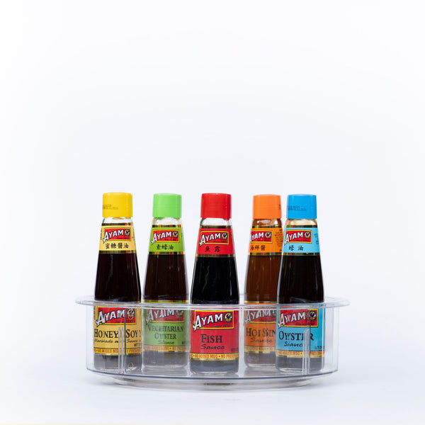 Tall Round Clear Rotating Tray - Lazy Susan storing various sauces, ideal kitchen organiser for easy access and better pantry organisation.