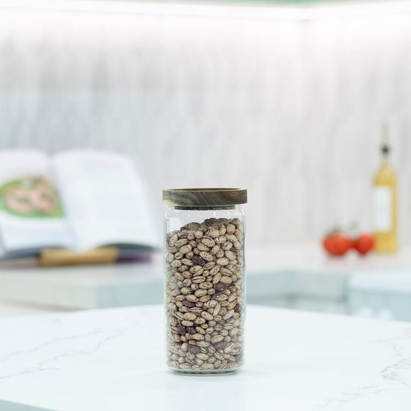 Round Glass Acacia Storage Jar Set – 5 Pack displayed on a kitchen countertop, ideal for pantry organisation with glass jars.
