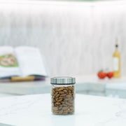 Glass Storage Jar – 550ml with Clear Stainless Lid on kitchen counter for efficient pantry organisation and storage of almonds.