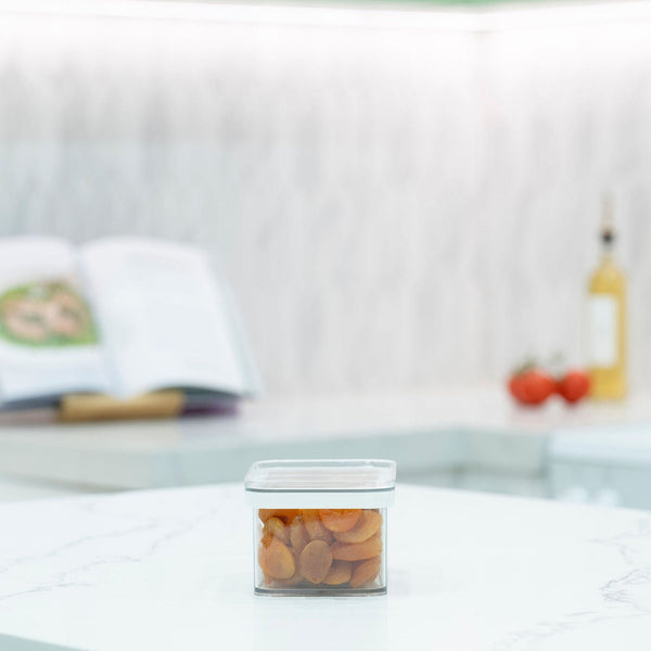 Clear Airtight Stackable Containers – 4 Sizes for kitchen use, ideal for storing dried apricots on a marble countertop.