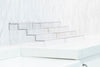 Expandable 4-Tier Clear Spice Rack Organiser in a kitchen, ideal for pantry organisation and enhancing storage efficiency.