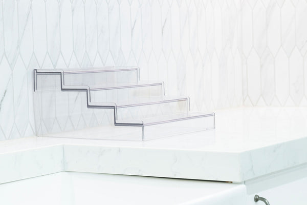 Expandable 4-Tier Clear Spice Rack Organiser on a white kitchen counter, ideal for pantry organisation and maximising storage.