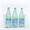 Three bottles of sparkling water stored in a clear Pull-Out Organiser, ideal for kitchen or pantry organisation.