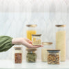 Square Acacia Spice Jars – 3 Sizes displayed on a kitchen countertop, ideal for adding elegance to pantry organisation.