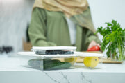 Mini Airtight Food Storage Container on kitchen counter with cucumbers and lemons, ideal for fridge and pantry organisation.