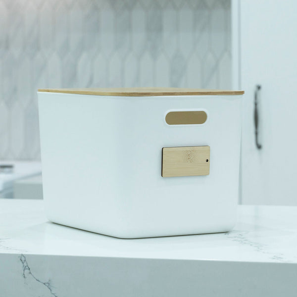 Stylish white plastic & bamboo storage container for kitchen organisation, ideal for pantry or counter.