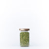 Round Glass Acacia Storage Jar filled with green peas, perfect for kitchen organisation and pantry storage solutions.