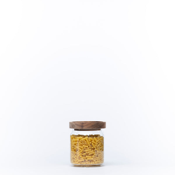 Round Glass Acacia Storage Jar filled with pasta for pantry and kitchen organisation.