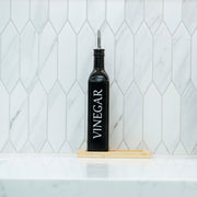 Black Oil and Vinegar Bottle – 500ml Modern Glass Dispenser on a kitchen benchtop for efficient pantry organisation.