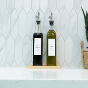 Clear Oil & Vinegar Bottles with Bamboo Tray – 500 ml for elegant kitchen storage organisers on a marble countertop.