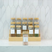 Bamboo Shaker Spice Jar – 120 ml on a kitchen counter, ideal for pantry organisation with glass jars for efficient spice storage.