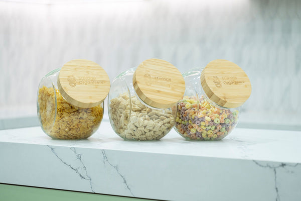 Round Tilt Glass Jar with Bamboo Lid – 4 L, perfect for pantry organisation, showcasing cereals neatly on a kitchen countertop.