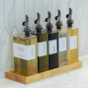 Bamboo Rectangle Tray holding glass bottles, ideal for kitchen organisation. Perfect storage organiser for pantry or countertop display.