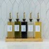Five Oil & Vinegar Book Bottles with Bamboo Tray, ideal for kitchen organisation and pantry storage, enhancing space efficiency.