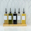 Glass Oil & Vinegar Book Bottle – 500ml Dispenser for kitchen and pantry organisation, held in a bamboo rack for easy access.