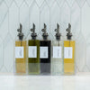 Glass Oil & Vinegar Bottles with Tray – 5 Pack displayed on kitchen counter for stylish pantry organisation.